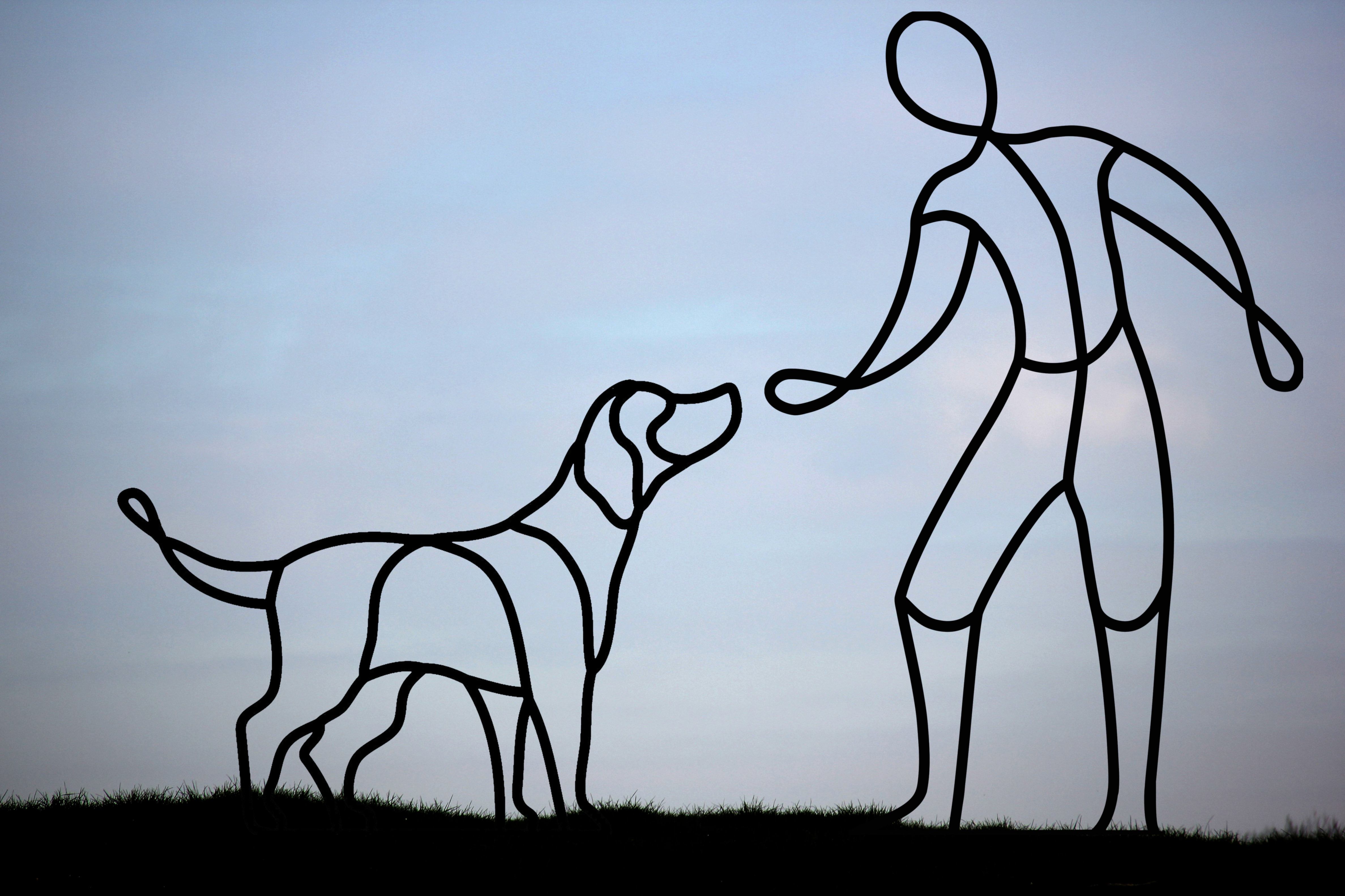 mans best friend a garden sculpture